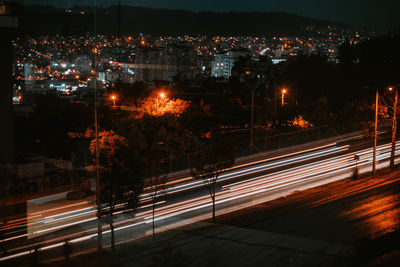 High angle view of light trails on road at night