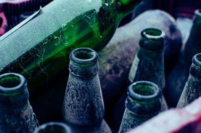 High angle view of old beer bottles
