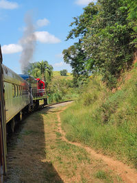 Train on railroad track against sky