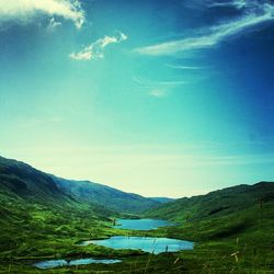 Scenic view of landscape against blue sky