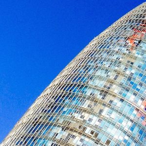 Low angle view of building against clear blue sky