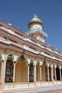 Low angle view of building against blue sky