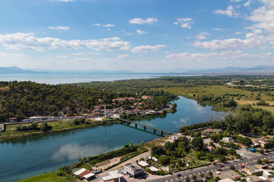 High angle view of buildings and trees against sky