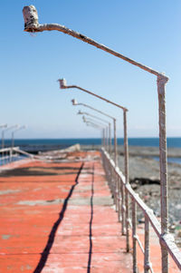 Close-up of railing against sea