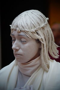 Close-up of woman with headdress