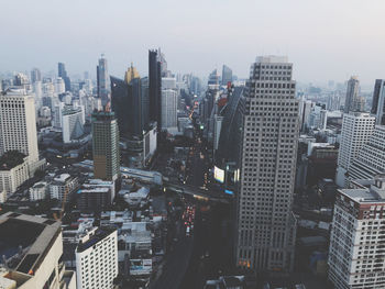 High angle view of modern buildings in city against sky