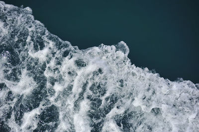 Close-up of waves on sea against sky