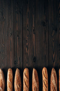 Directly above shot of shoes on wooden wall