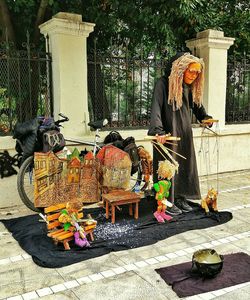 Rear view of woman for sale at market stall