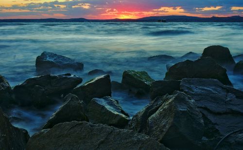 Scenic view of sea against cloudy sky
