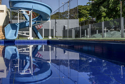 Reflection of man in swimming pool