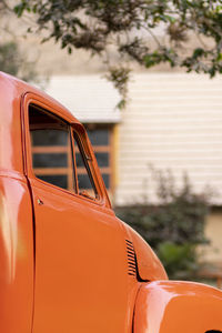 Close-up of car parked against trees