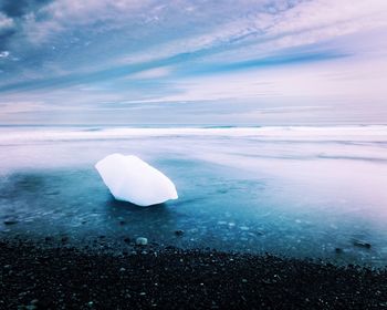 Scenic view of sea against sky during winter