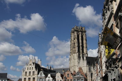 Low angle view of buildings against sky in city