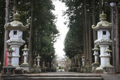 Statue amidst trees at temple