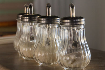 Close-up of glass jar on table