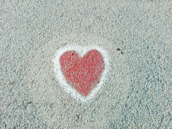 Close-up of red heart shape on wall