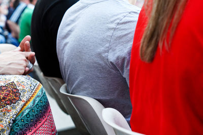 Midsection of man holding woman