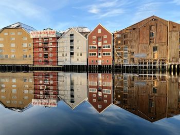 Reflection of building in water in trondheim