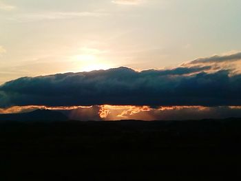 Scenic view of mountains at sunset