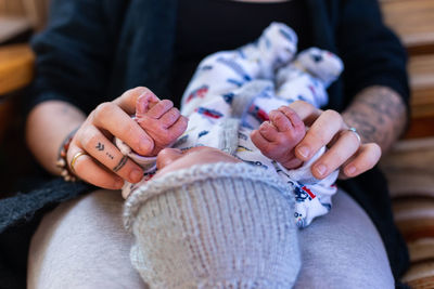 Midsection of woman holding hands