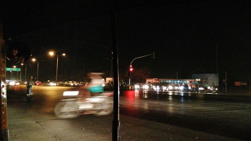 Cars on street at night