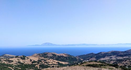 Scenic view of mountains against clear blue sky