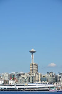 Space needle in city against sky