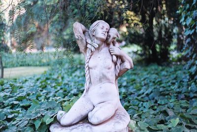 Statue of angel in park