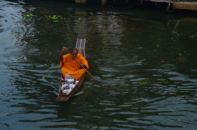 High angle view of man on boat in lake