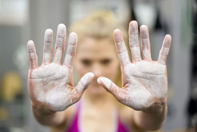 Close-up of human hand against blurred background