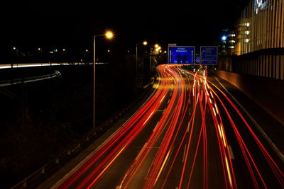 High angle view of light trails on road at night