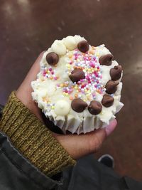 Close-up of hand holding ice cream