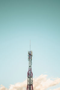 Low angle view of communications tower against sky