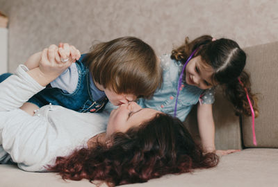 Rear view of mother and daughter at home