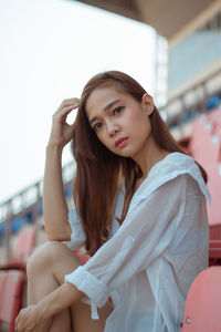 Portrait of young woman looking away