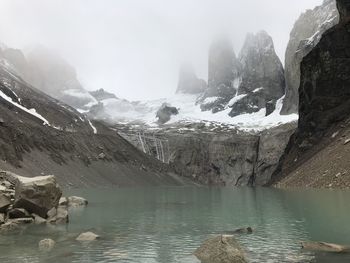 Scenic view of lake and mountains during winter