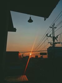 Low angle view of silhouette buildings against sky during sunset