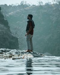 Full length of man standing on rock