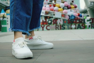 Low section of woman in shoes standing outdoors