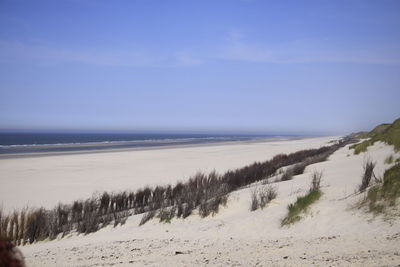 Scenic view of sea against clear sky during winter