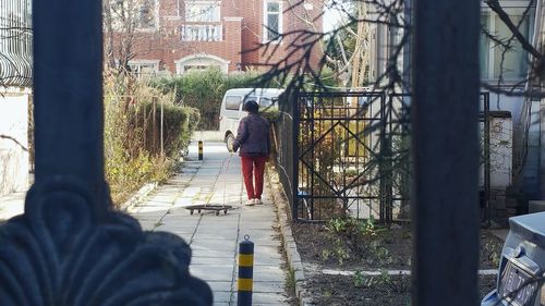 People walking on sidewalk in city