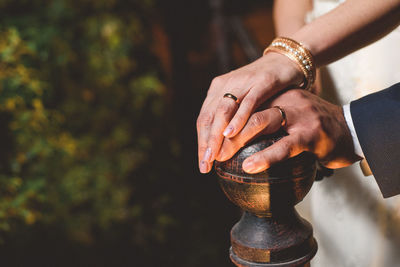 Close-up of married couple's hands