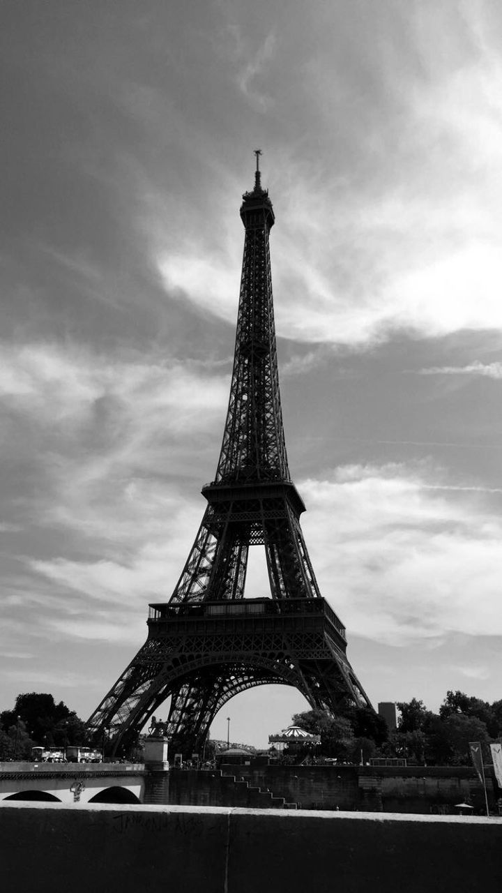 architecture, sky, eiffel tower, built structure, famous place, international landmark, tower, travel destinations, culture, metal, tall - high, tourism, capital cities, travel, cloud - sky, low angle view, history, building exterior, cloudy, city