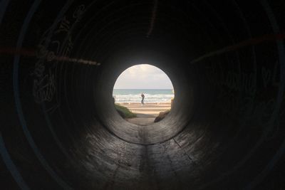 Scenic view of sea seen through hole