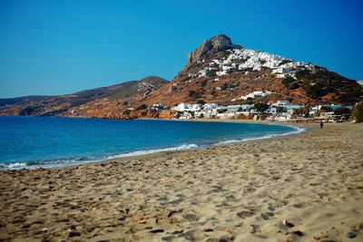 Scenic view of sea against clear blue sky