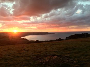 Scenic view of sunset over lake