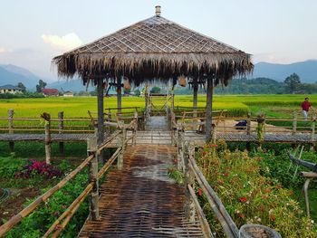 Panoramic view of hut on land against sky