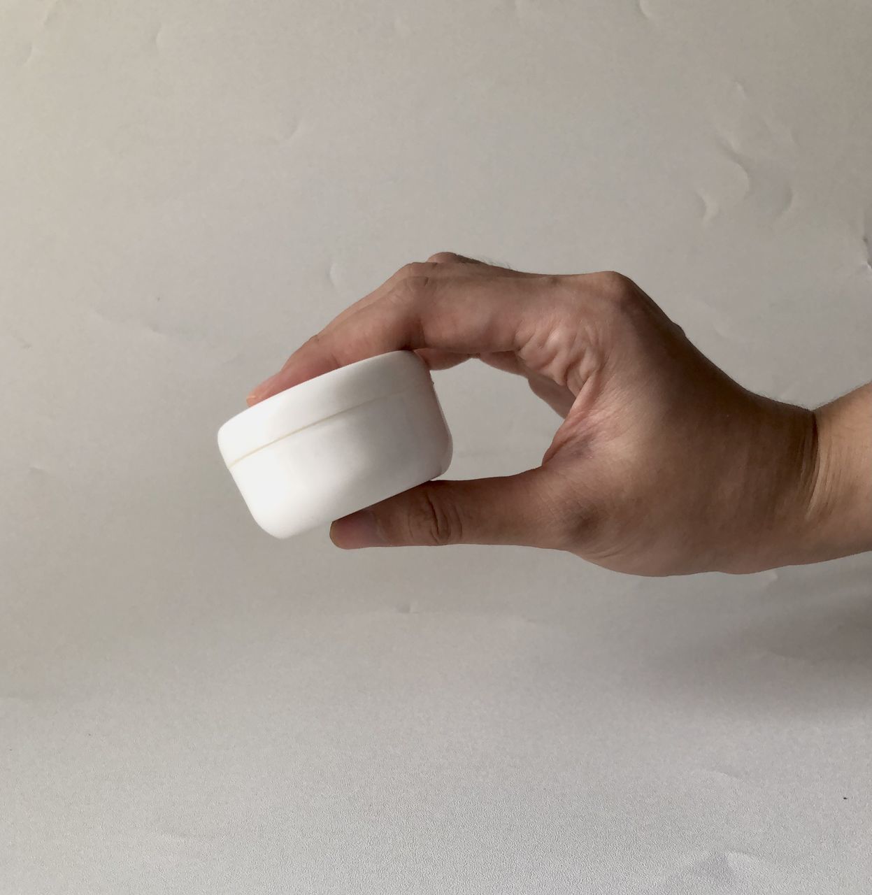 hand, one person, finger, indoors, adult, holding, close-up, food and drink, limb, cup, studio shot, drink