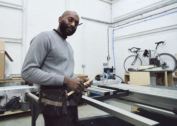 Portrait of carpenter working at workshop